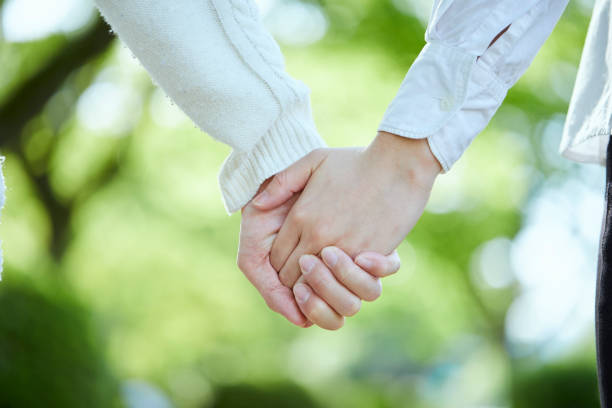 Hands of a couple holding hands