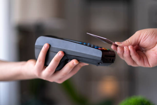 istock Making mobile payments from pos device via mobile phone 1317208524