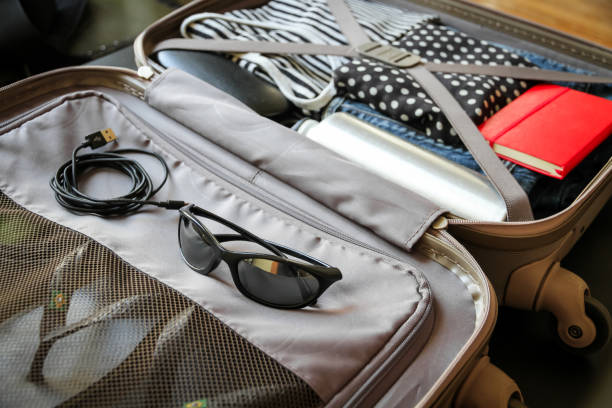 istock Open vintage suitcase full of clothes 1317208784