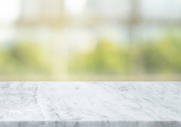 istock Selective focus,Marble table top on blur window glass in morning background.For 1317210382