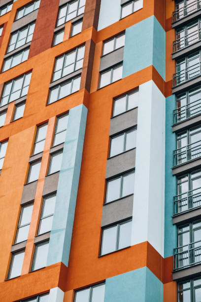 istock Modern building angle and windows. Multistory new multicolored apartment building. Stylish living block of flats. Bright juicy colors in the construction of buildings 1317210529