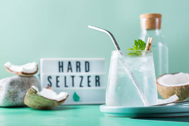 tropical hard seltzer cocktail with coconut water and ice - hard drink imagens e fotografias de stock