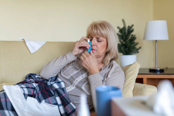 istock Sick Older Woman in the Bed with Asthmatic Problems. 1317211687
