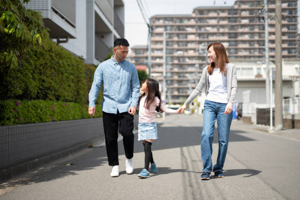 istock Family walking in residential district 1317211773