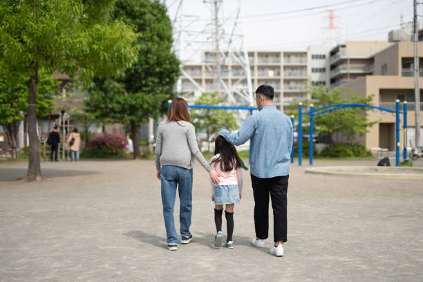 istock Family walking in residential district 1317212540