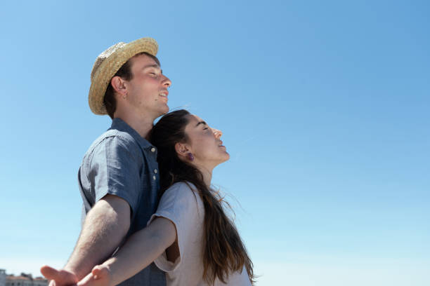 istock Couple breathing and relaxing together 1317214917