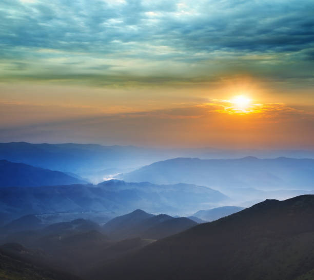 istock sunrise over a mountain valley 1317216578