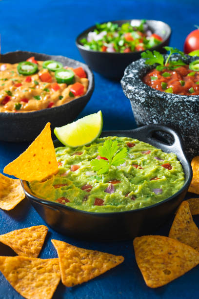 istock Guacamole with Nacho chips and assorted Mexican Dip, pico de gallo,Cheddar cheese dip 1317218832