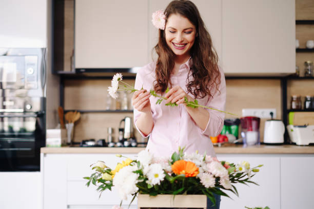 istock Beautiful florist arranging a flower composition 1317219584