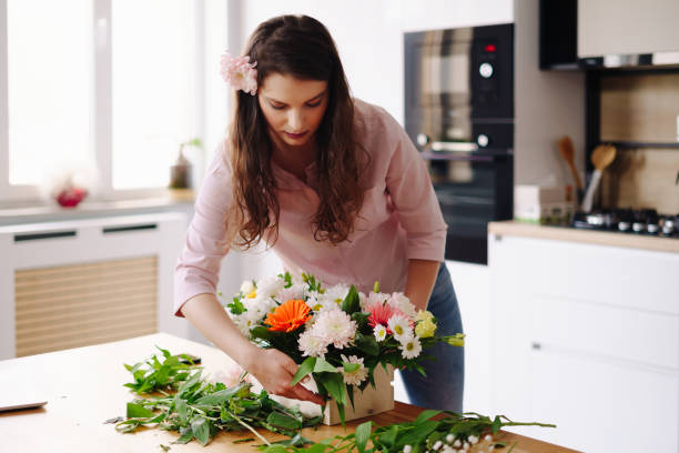 istock Beautiful florist arranging a flower composition 1317219587