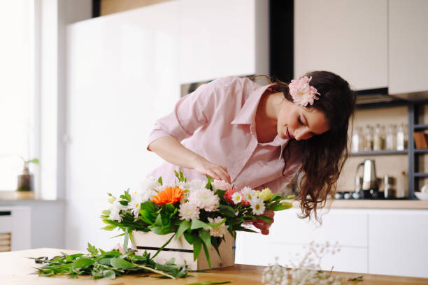 istock Beautiful florist arranging a flower composition 1317219594