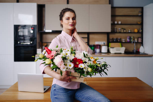 istock Portrait smiling woman with a beautiful flower composition 1317219680