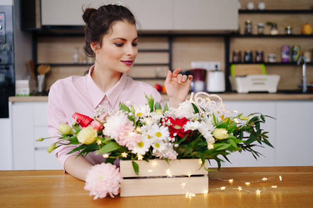 istock Beautiful florist arranging a flower composition 1317219791