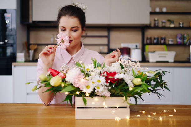 istock Beautiful florist arranging a flower composition 1317219800