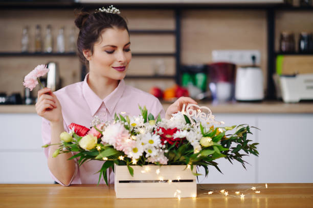 istock Beautiful florist arranging a flower composition 1317219809