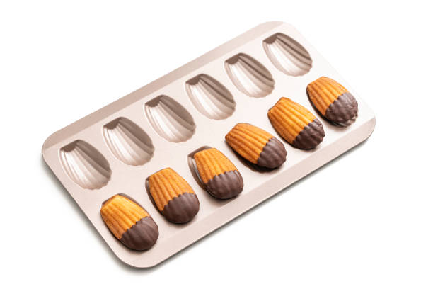 istock Madeleines Homemade and melted chocolate in a mold isolated on white 1317219947