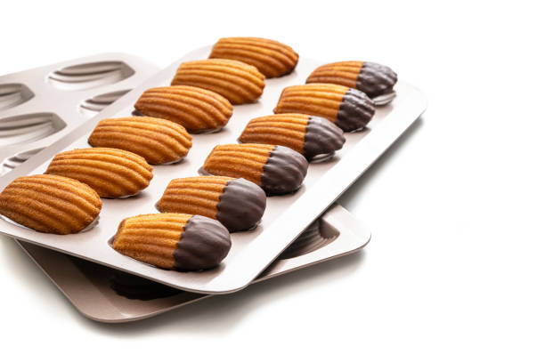 istock Madeleines Homemade and melted chocolate in a mold isolated on white 1317220148
