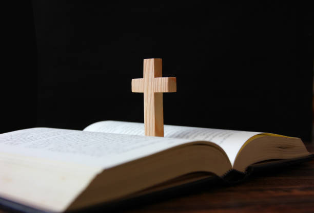 istock cross on bible religion concept 1317225003