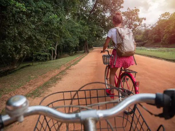 Couple exploring sightseeing in Sri Lanka with bicycle. Eco tourism people visiting famous places with own transportation. two people travel Sri Lanka
