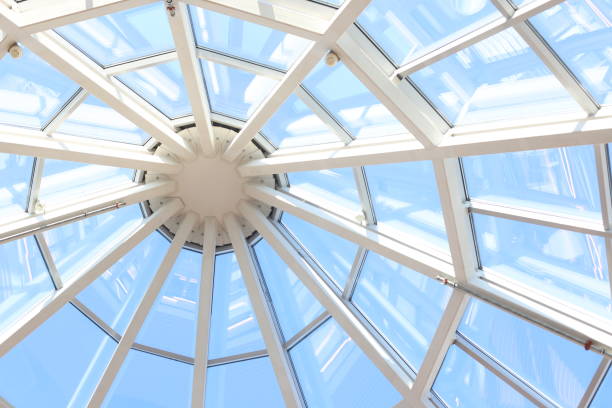 istock Glass dome with white structure in shopping mall in sunny day. 1317225562