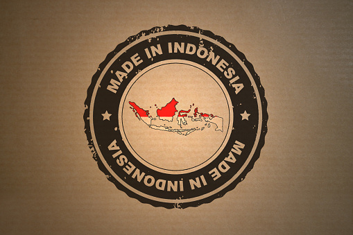Brown paper with in its middle a retro style stamp Made in Indonesia include the map and flag of Indonesia.