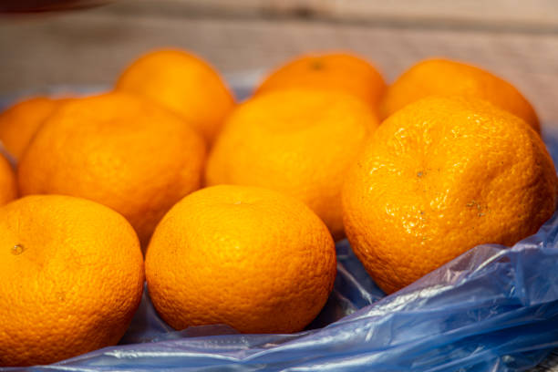istock Tangerines lie in a package on the background 1317228121