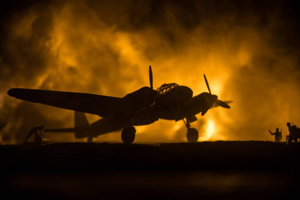 istock German Junker (Ju-88) night bomber at night. Artwork decoration with scale model of jet-propelled plane in possession. Toned foggy background with light. War scene. 1317229971