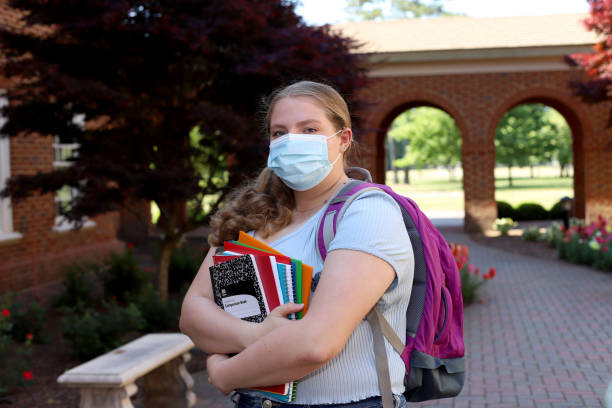 istock 14 year old girl read for back to school posing with her notebooks and backpack. 1317231437