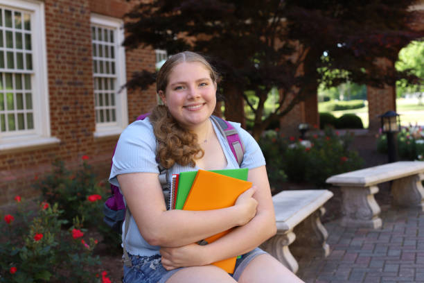 istock 14 year old girl read for back to school posing with her notebooks and backpack. 1317231935