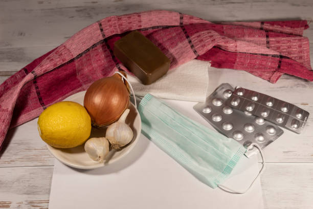 istock preventing colds - lemon, garlic, onions and soap for washing hands. 1317232435