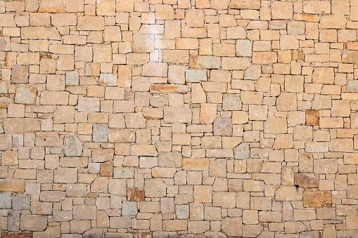 Old ancient roman block stone wall background