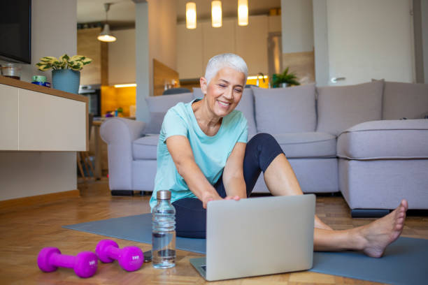 istock Senior woman using smartphone at home after exercise. 1317233145