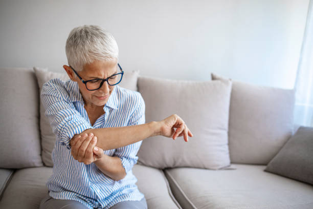 istock Elbow Pain In An Elderly Person. 1317235463