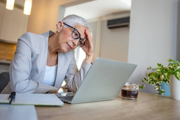 istock Female entrepreneur with headache sitting at desk. 1317235529