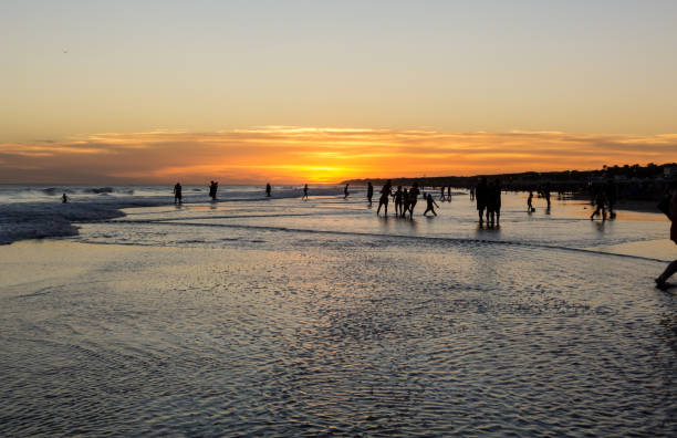 istock Silhouettes over water at sunset 1317235651