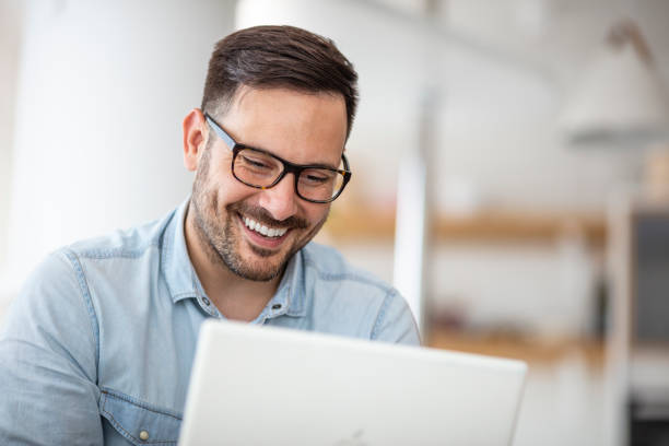 istock Young man working at home in the evening. 1317236710