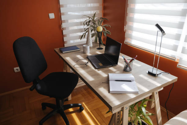istock Workplace with laptop in home interior 1317236923