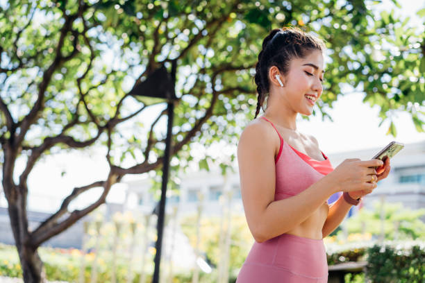 istock Woman checking phone during morning run 1317237175
