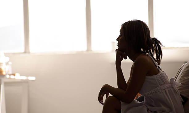 istock Silhouette of woman thinking 131723929
