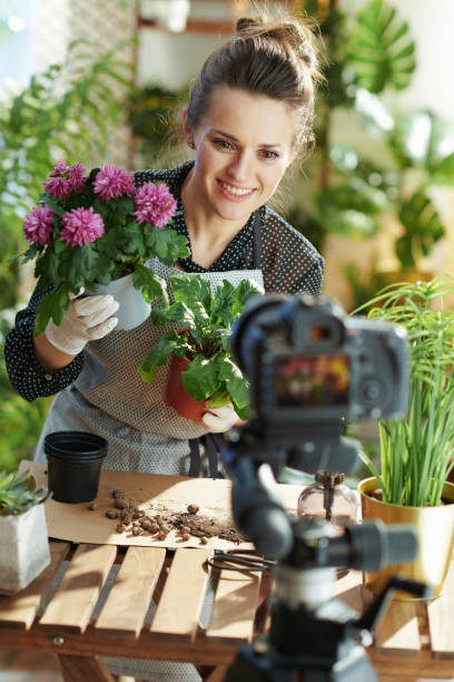 istock happy woman records gardening educational video tutorials 1317240445
