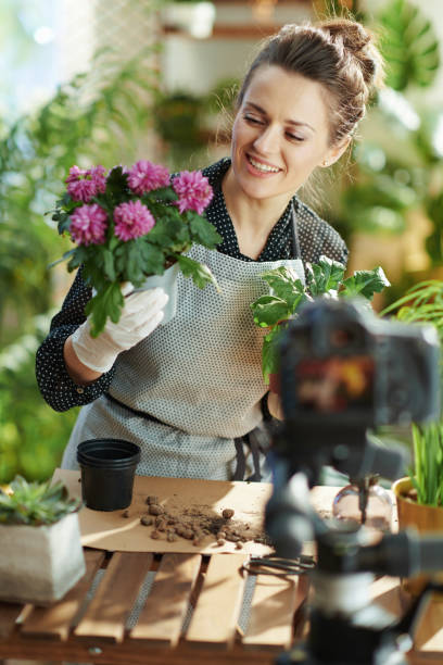 istock happy woman records gardening educational video tutorials 1317240455