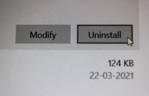 istock Closeup macro shot of a pop up wizard with uninstall and modify permission of a computer software along with a date. Notification on laptop screen. 1317242363
