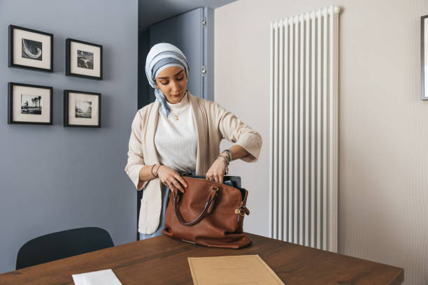 istock Woman preparing the suitcase before going to work in the morning 1317242941