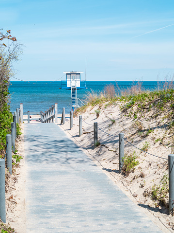 Sandy beach with sea coast and pier in Malmo, Sweden