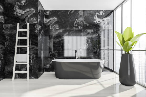 istock Bathroom interior. Minimalist bathtub, on white floor with plant and panoramic windows 1317246487
