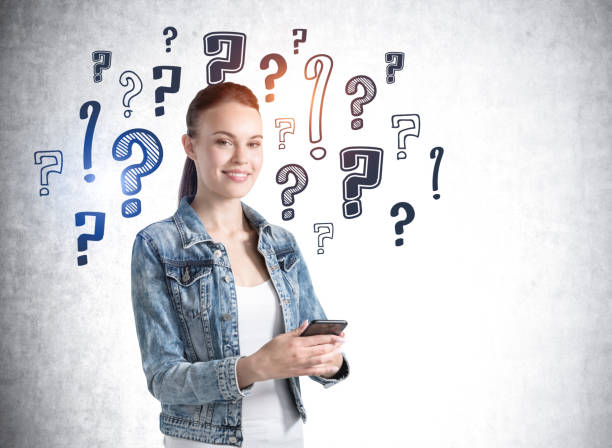 istock Young woman with phone in hands, question marks sketch 1317246893