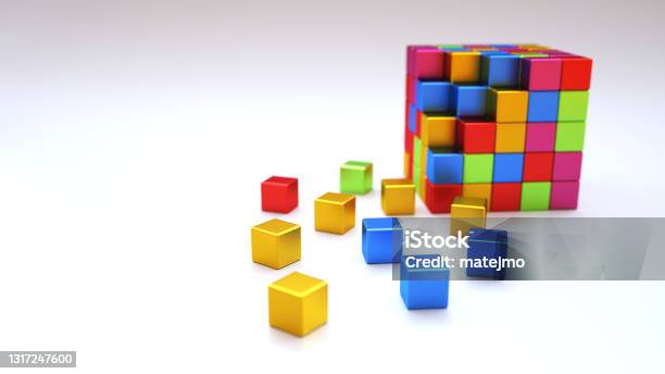 An Abstract Colorful Structure Made Out Of Shiny Metallic Cube Blocks On A Dark Wooden Surface Stock Photo - Download Image Now