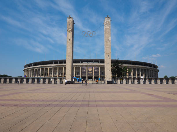 Berlin / Germany - July 2019: Summer flight over Olympiastadion, a sports stadium at Olympiapark in Berlin. It was originally built by Werner March for the 1936 Summer Olympics