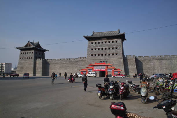 Datong, Shanxi Province, China - October 23, 2011: Men walking outside the south wall of Datong.