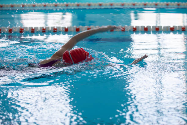 istock Child athlete swims in the pool. Swimming section. 1317253667